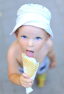 Boy with ice cream A little boy is eating an ice cream cone.