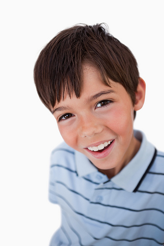 dental-reading-list A young boy with a smile on his face.