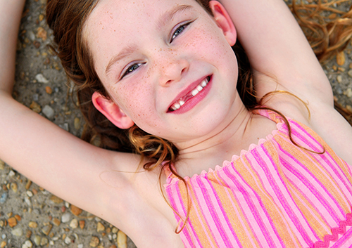 A girl laying on the ground.