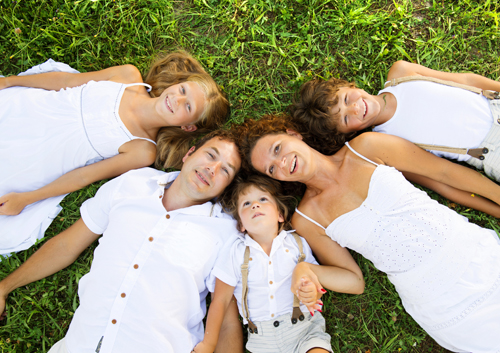 family-on-grass_32641958 A family laying on the grass.