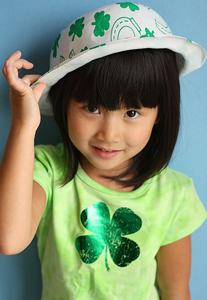 holiday-st-patrick-girl2 A little girl wearing a green shamrock hat.
