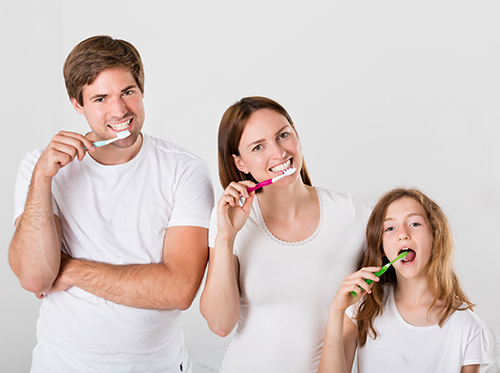 A family is brushing their teeth.